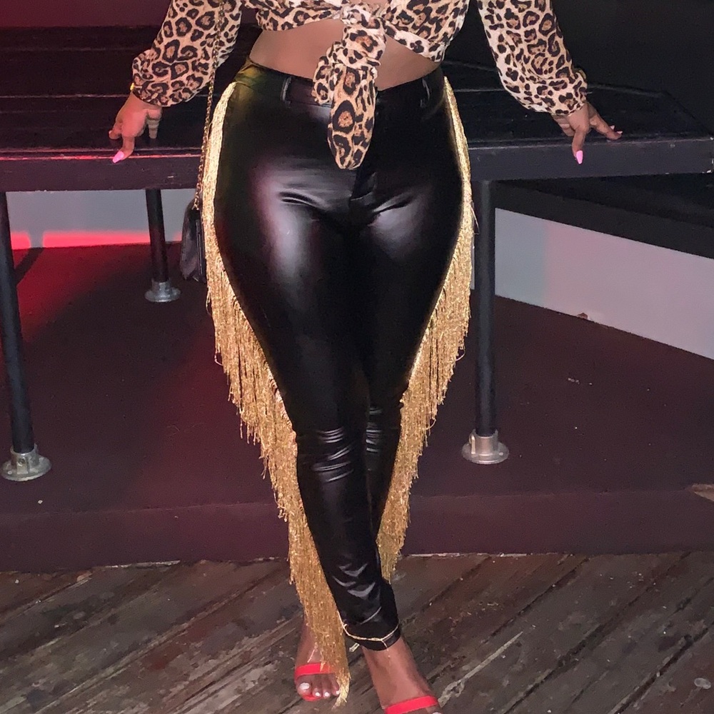 Black leather pants with gold shingles.